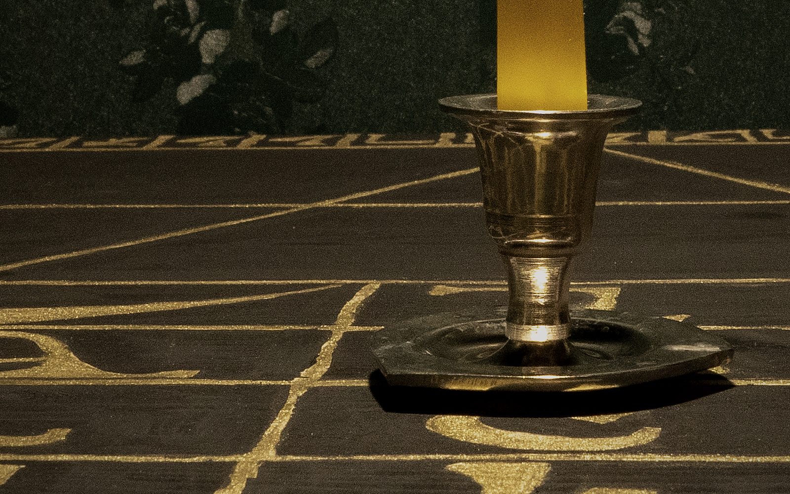 Gilded Enochian characters painted across the surface of the Holy Table
