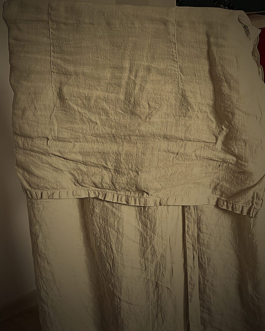 Ceremonial vestment of pure unbleached linen in the temple